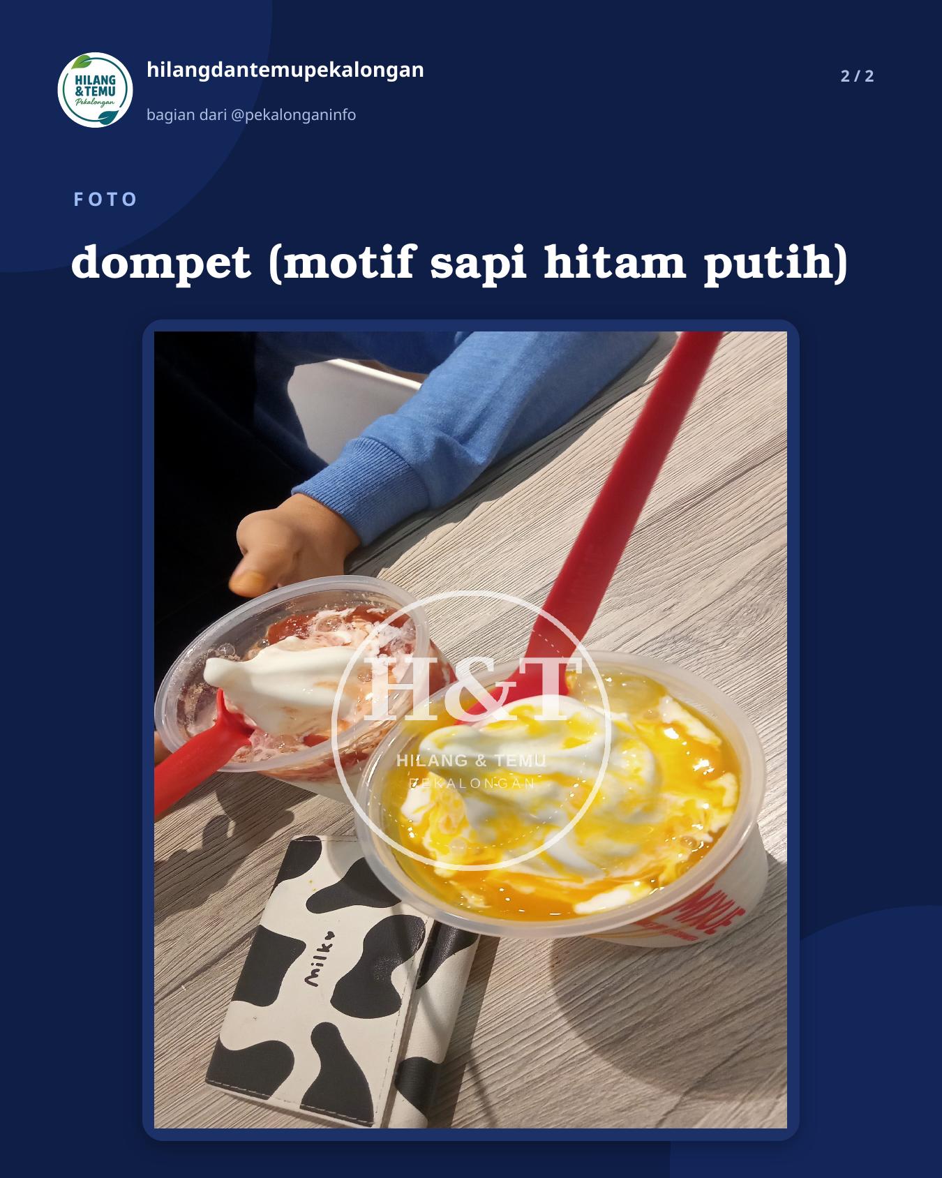 Slide 2 laporan dompet (motif sapi hitam putih)
