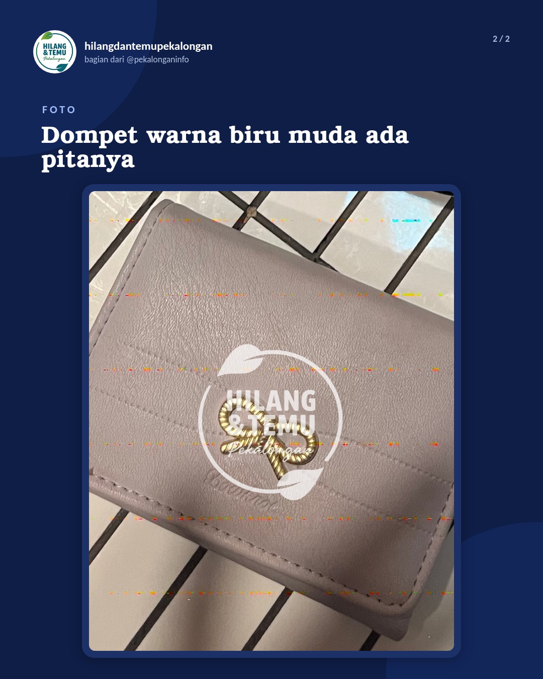 Slide 2 laporan Dompet warna biru muda ada pitanya