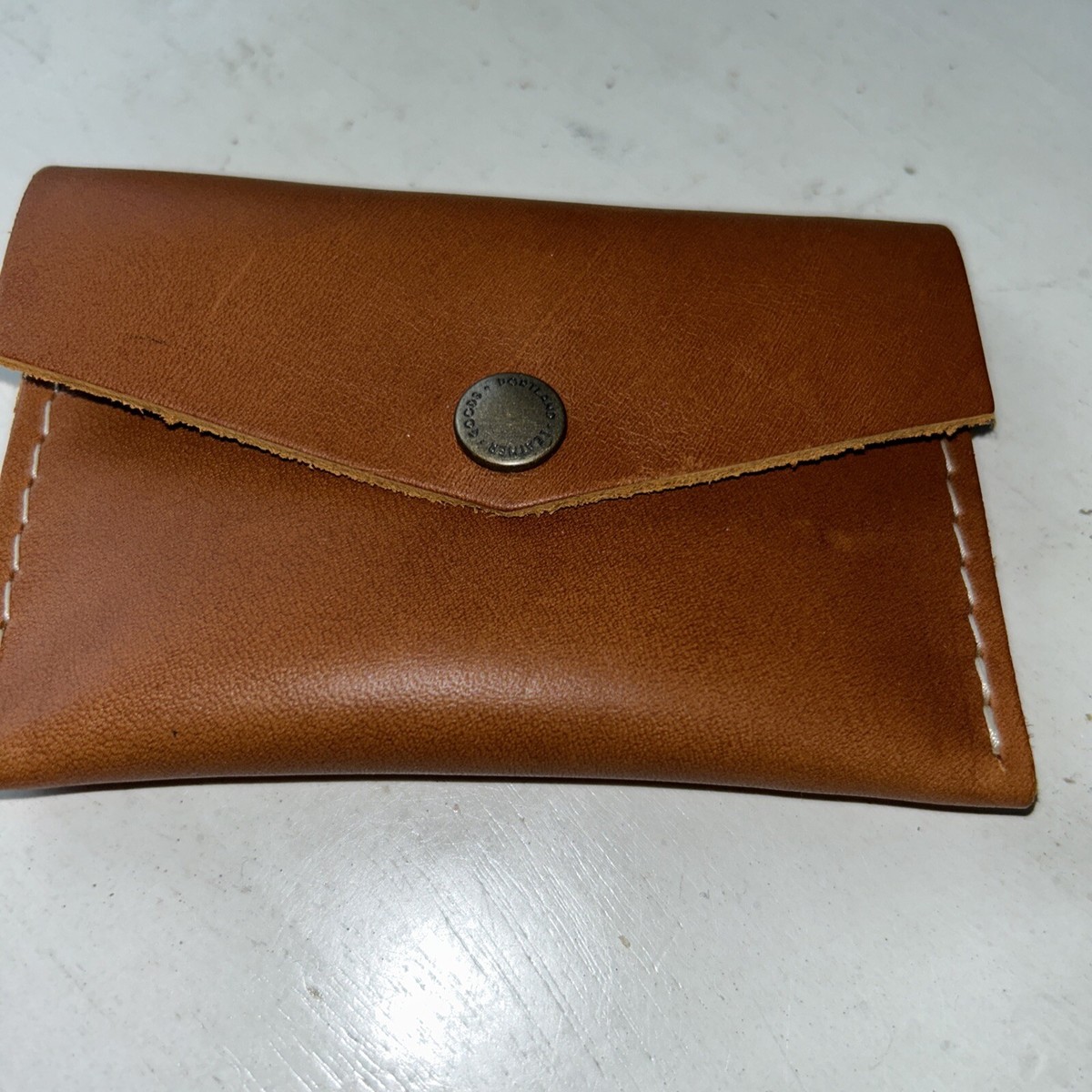 Foto laporan Dompet berwarna coklat (HB7802)