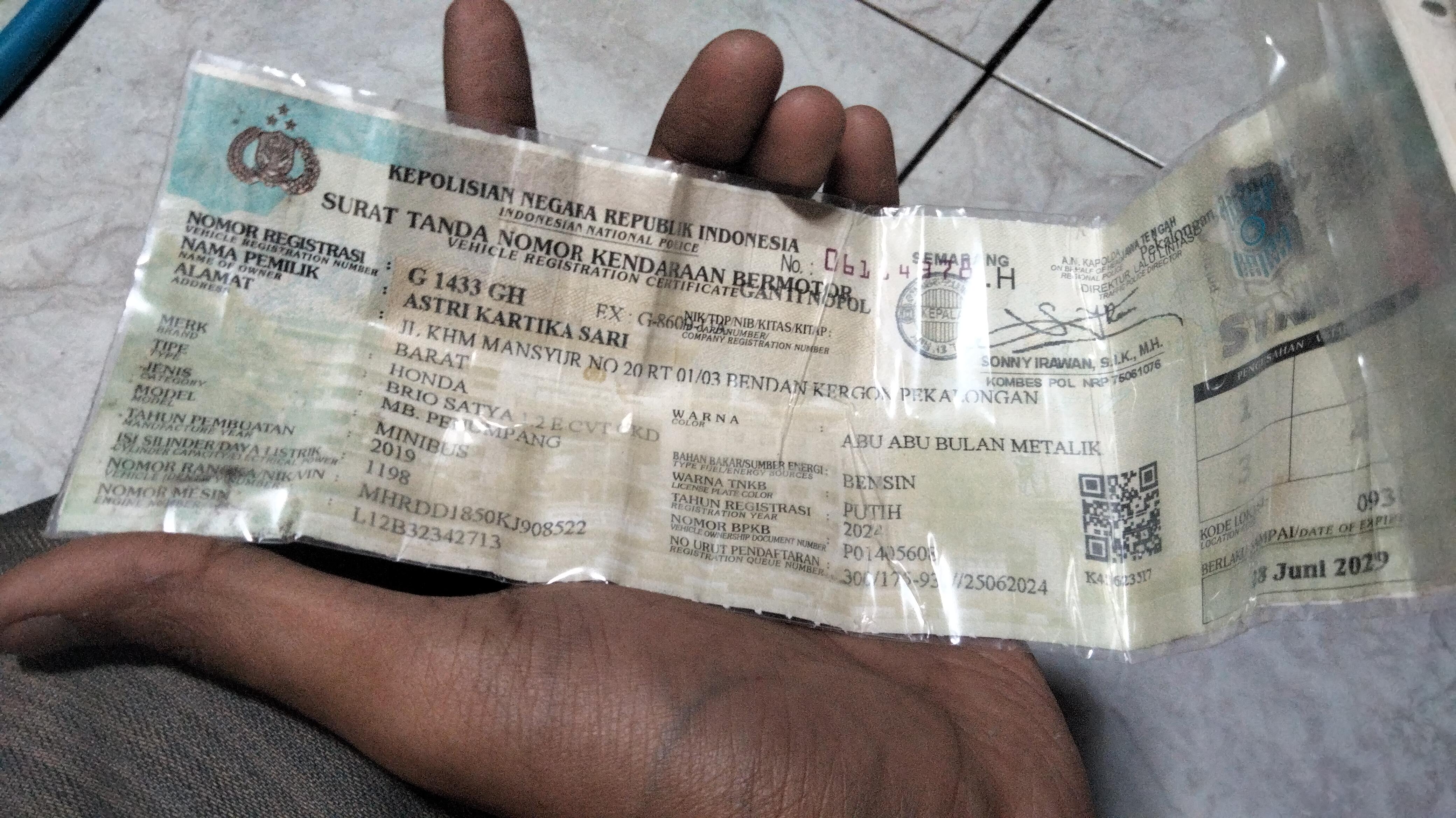 Foto laporan dompet biru berisi STNK mobil (TB1565)