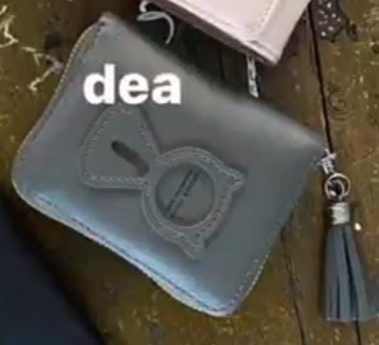 Foto laporan Dompet Warna Abu Ada Gambar Kucing (HB0371)