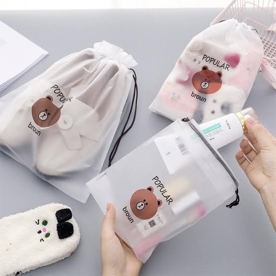 Foto laporan pouch bening bergambar bear berisi uang dan nota (HB1531)