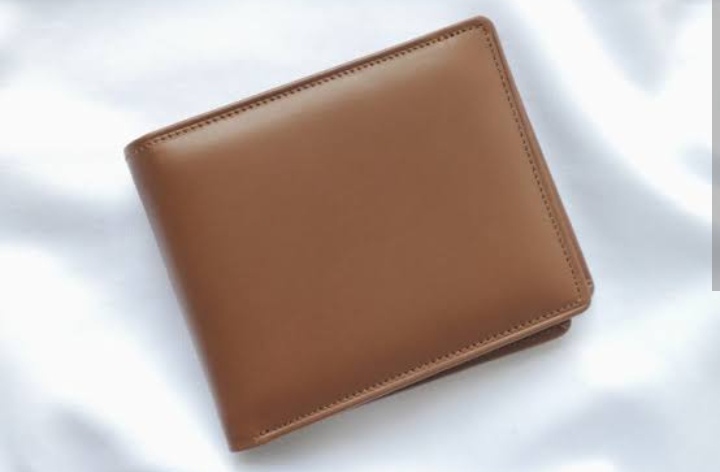 Foto laporan Dompet coklat serta isi nya ATM BCA ATM BRI dan KTA serta uang dan foto (HB2745)