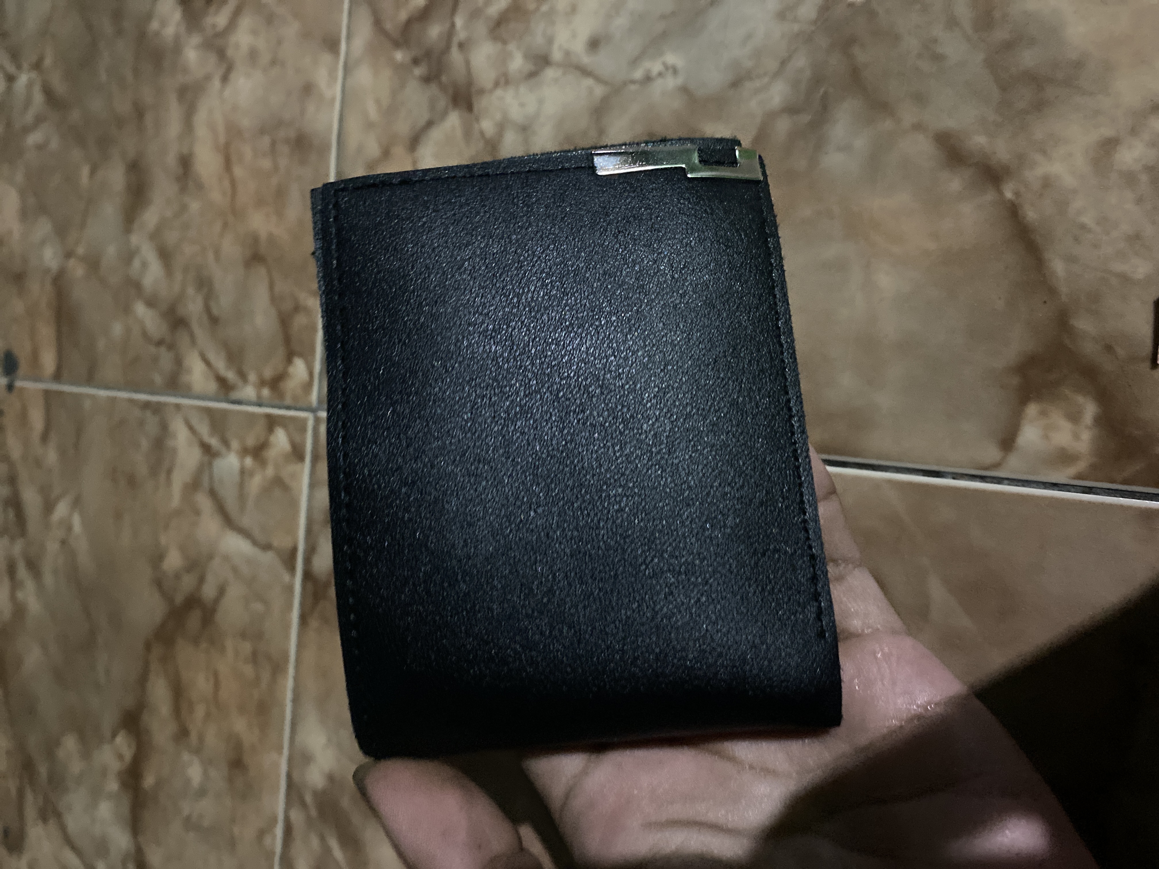 Foto laporan dompet hitam (HB5141)