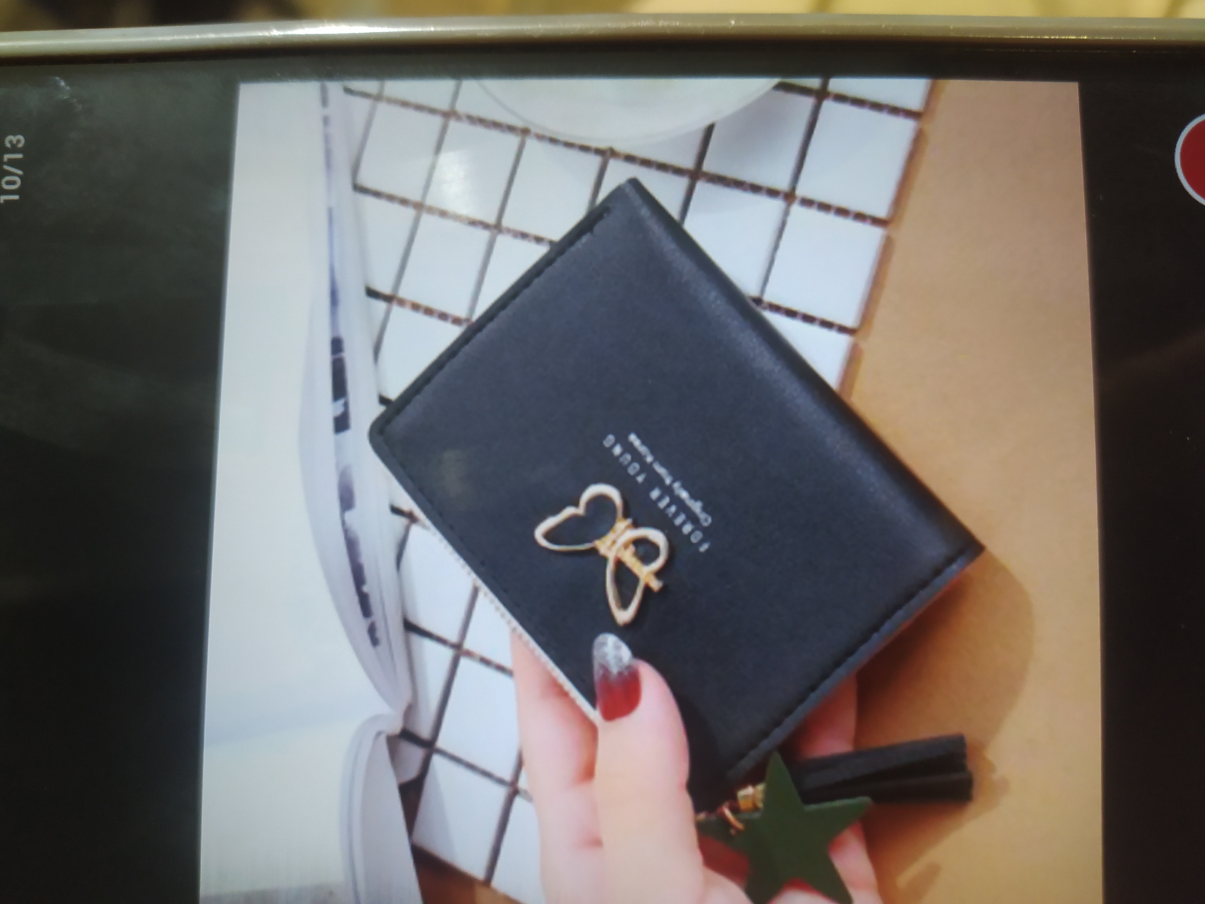 Foto laporan Dompet kecil hitam pita kupu" (HB5206)