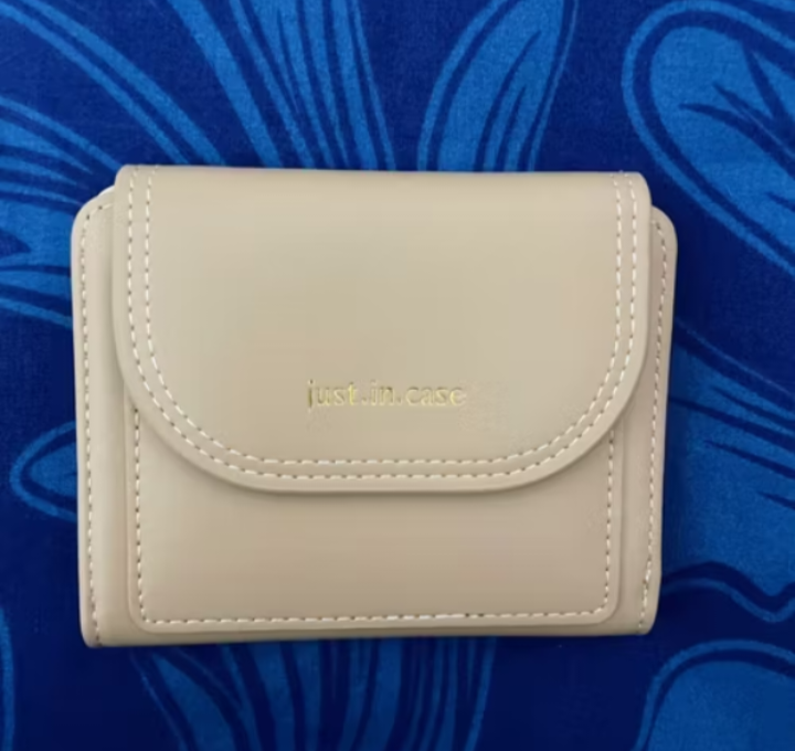 Foto laporan Dompet lipat warna apricot/cream muda (HB5906)