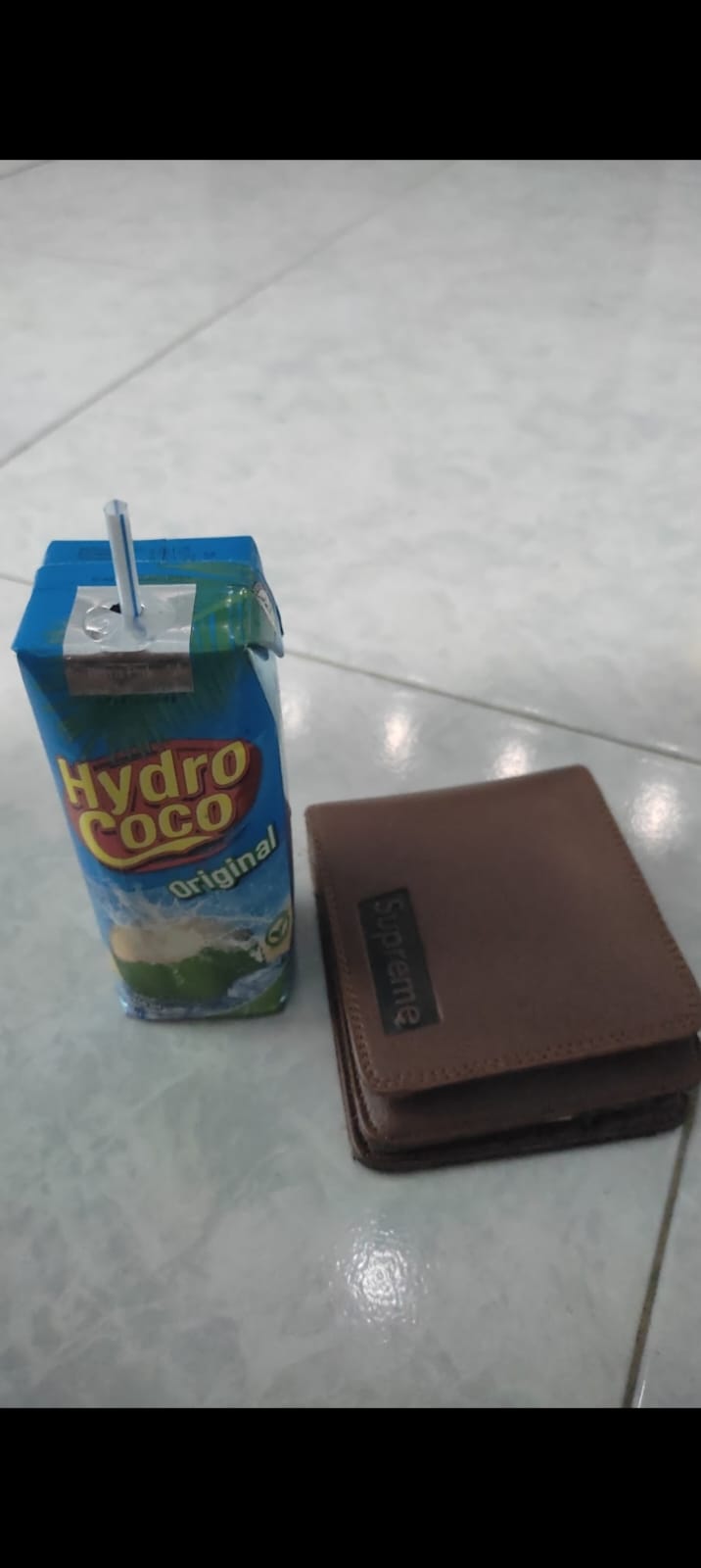 Foto laporan dompet berwarna coklat (HB6601)
