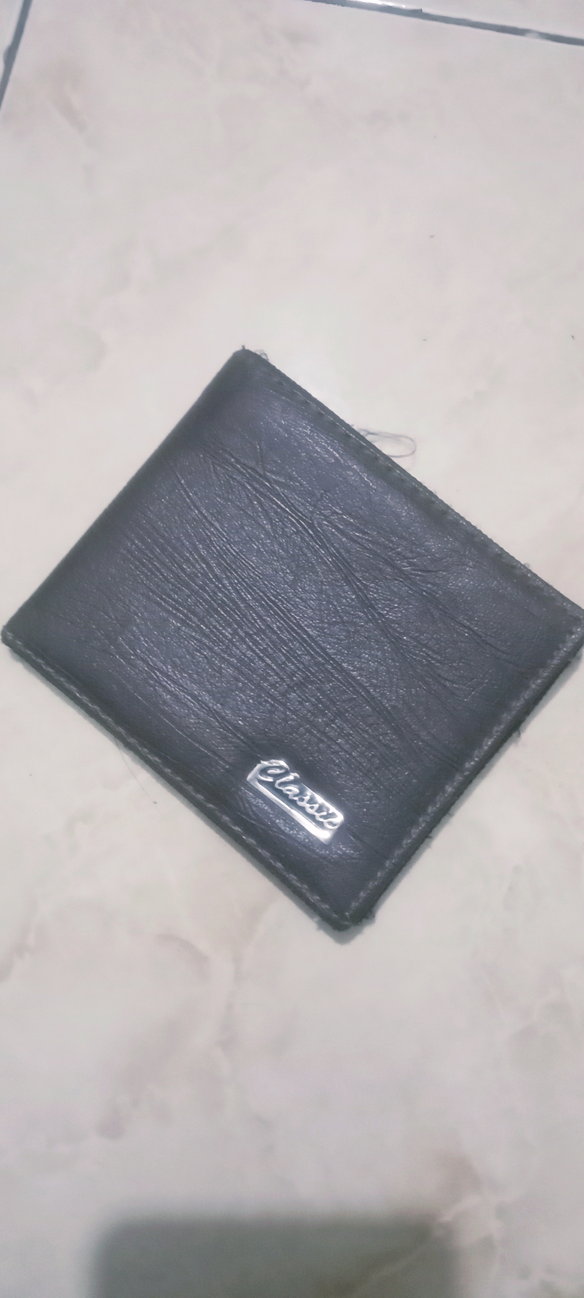 Foto laporan dompet warna hitam (HB6999)