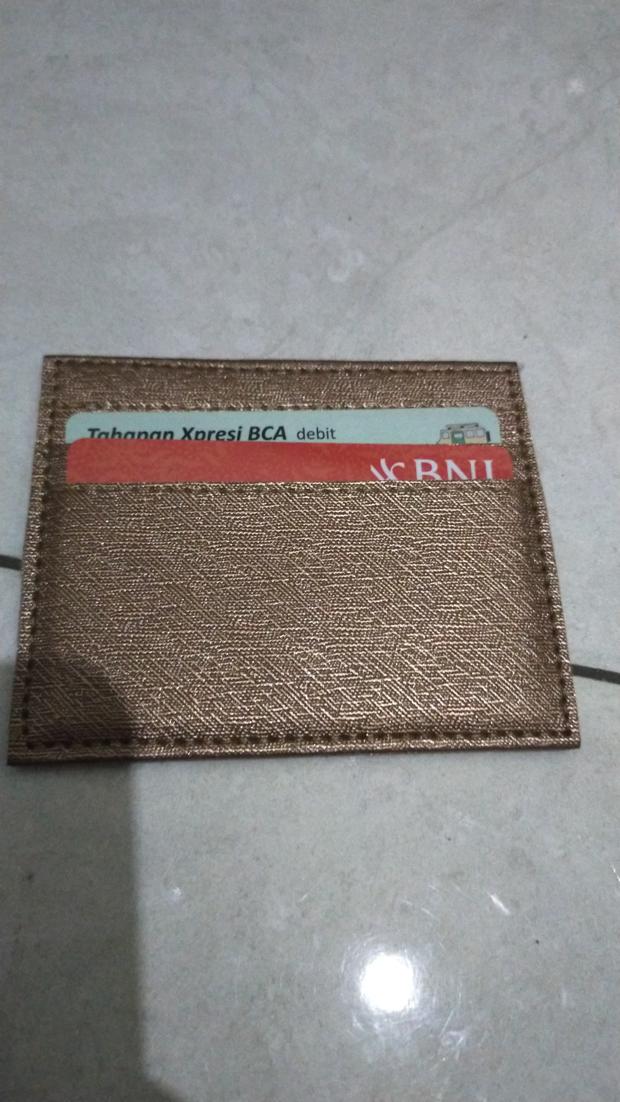 Foto laporan dompet kartu (HB7167)