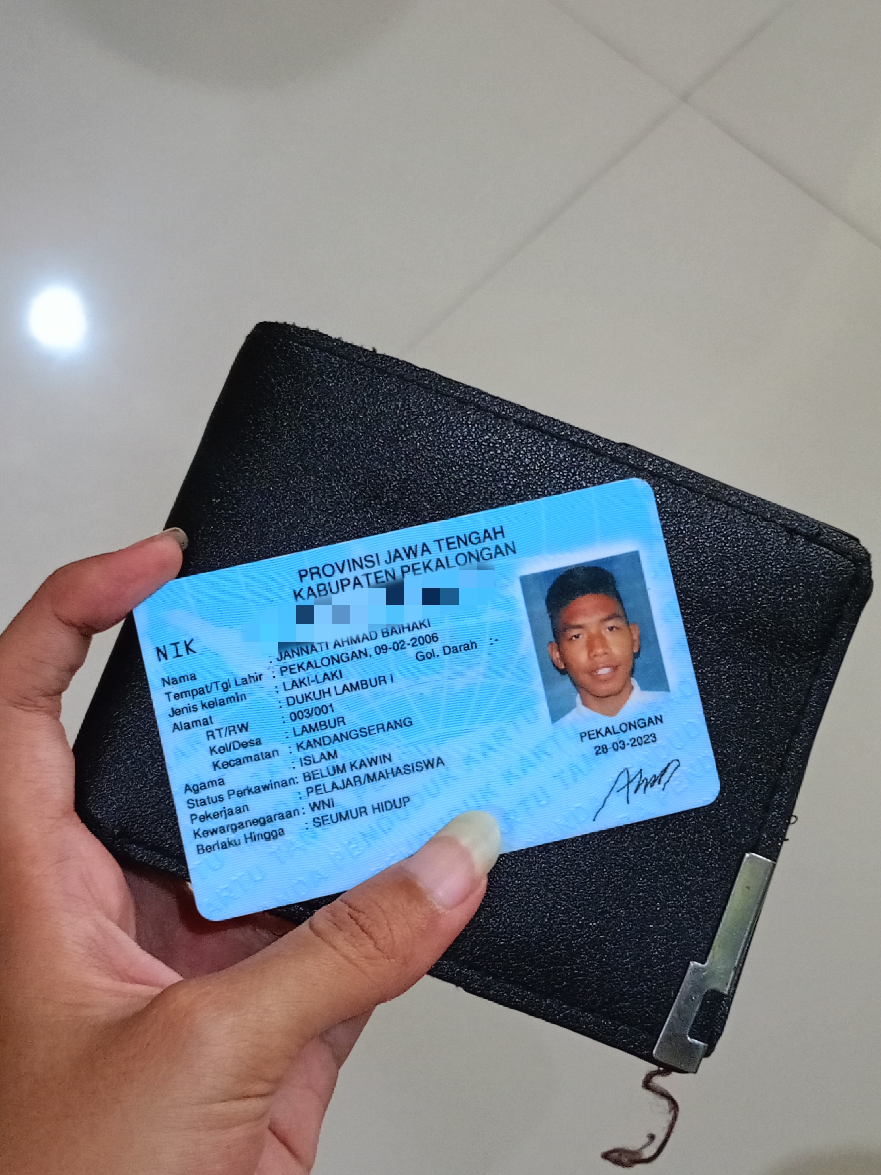 Foto laporan dompet berwarna hitam (TB0170)