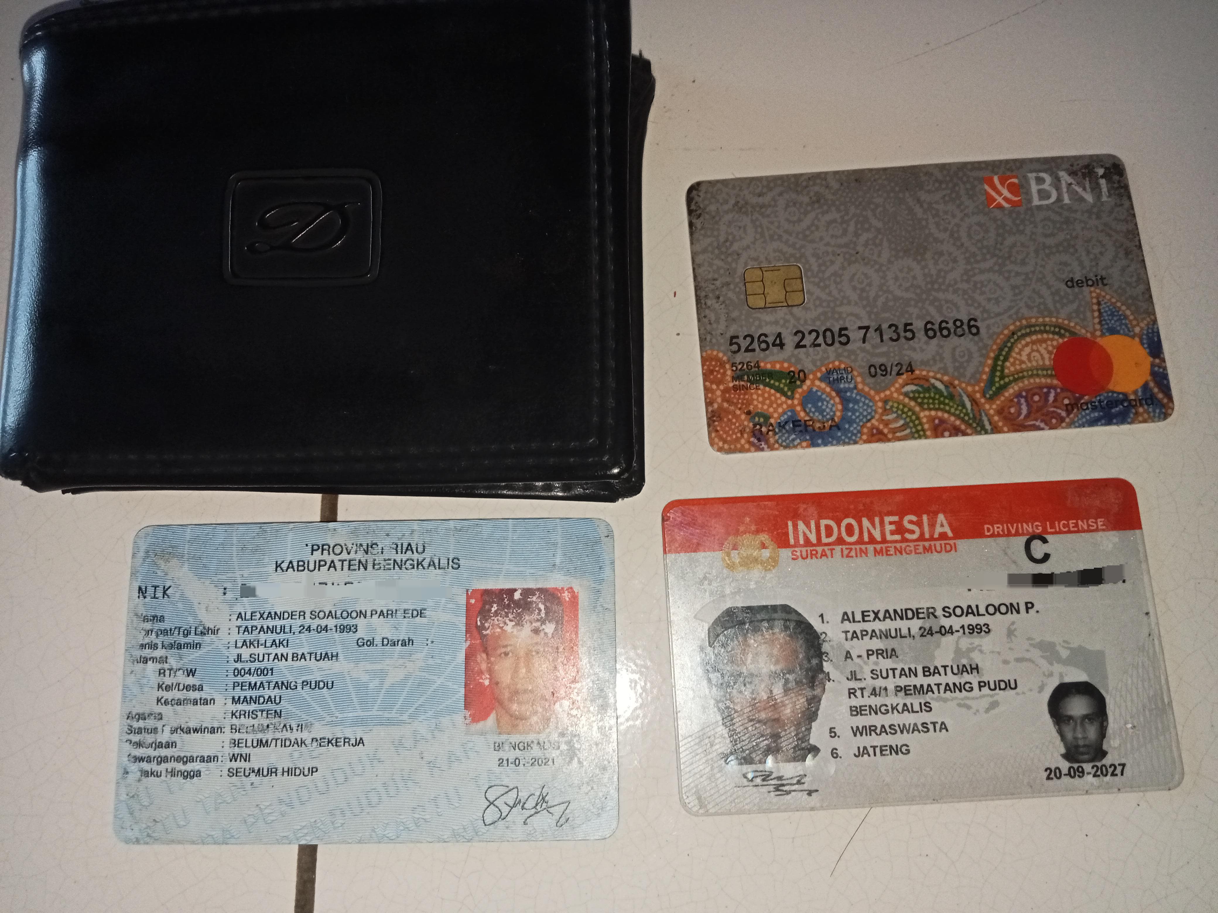 Foto laporan dompet hitam (TB0214)