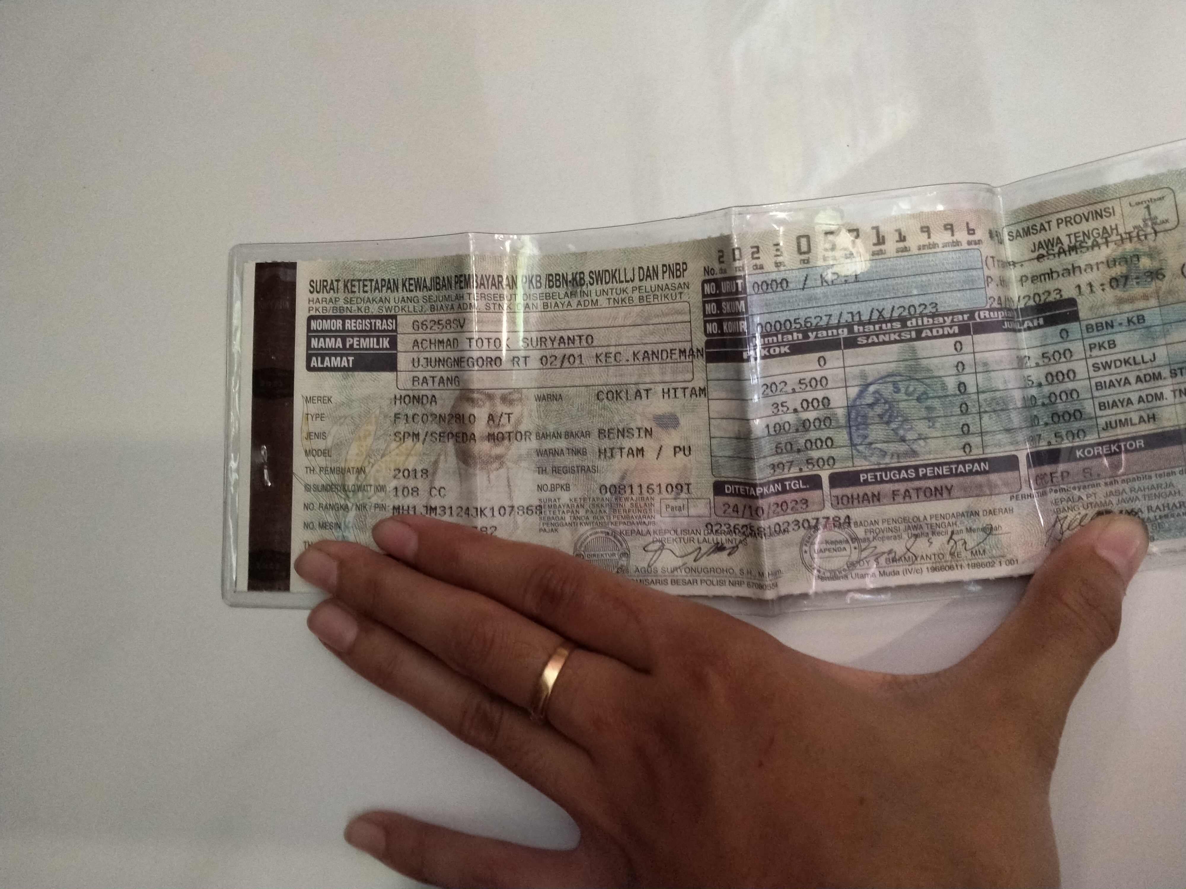 Foto laporan STNK a.n Achmad Totok Suryanto, alamat Ujungnegoro (TB0302)