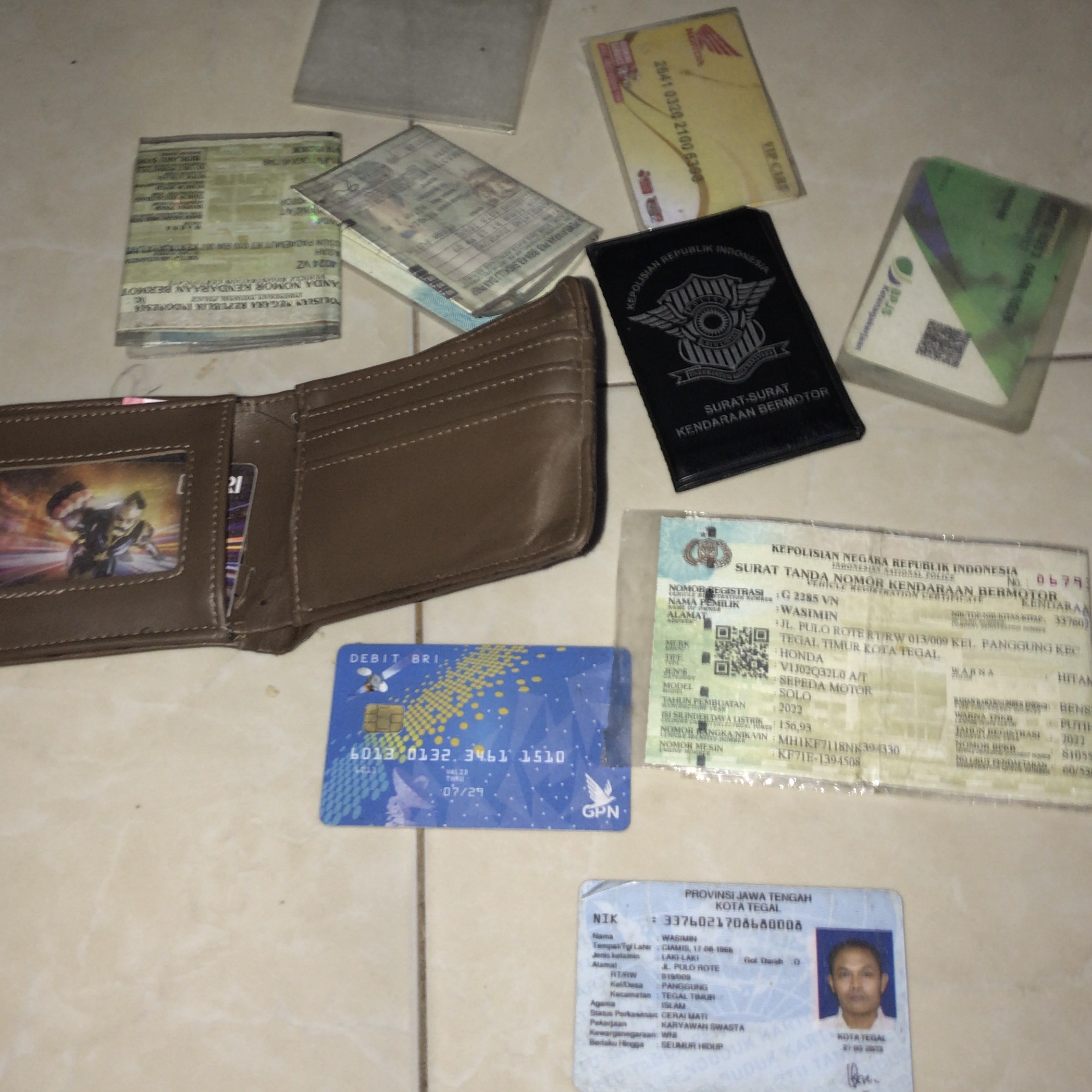 Foto laporan Dompet (TB0405)
