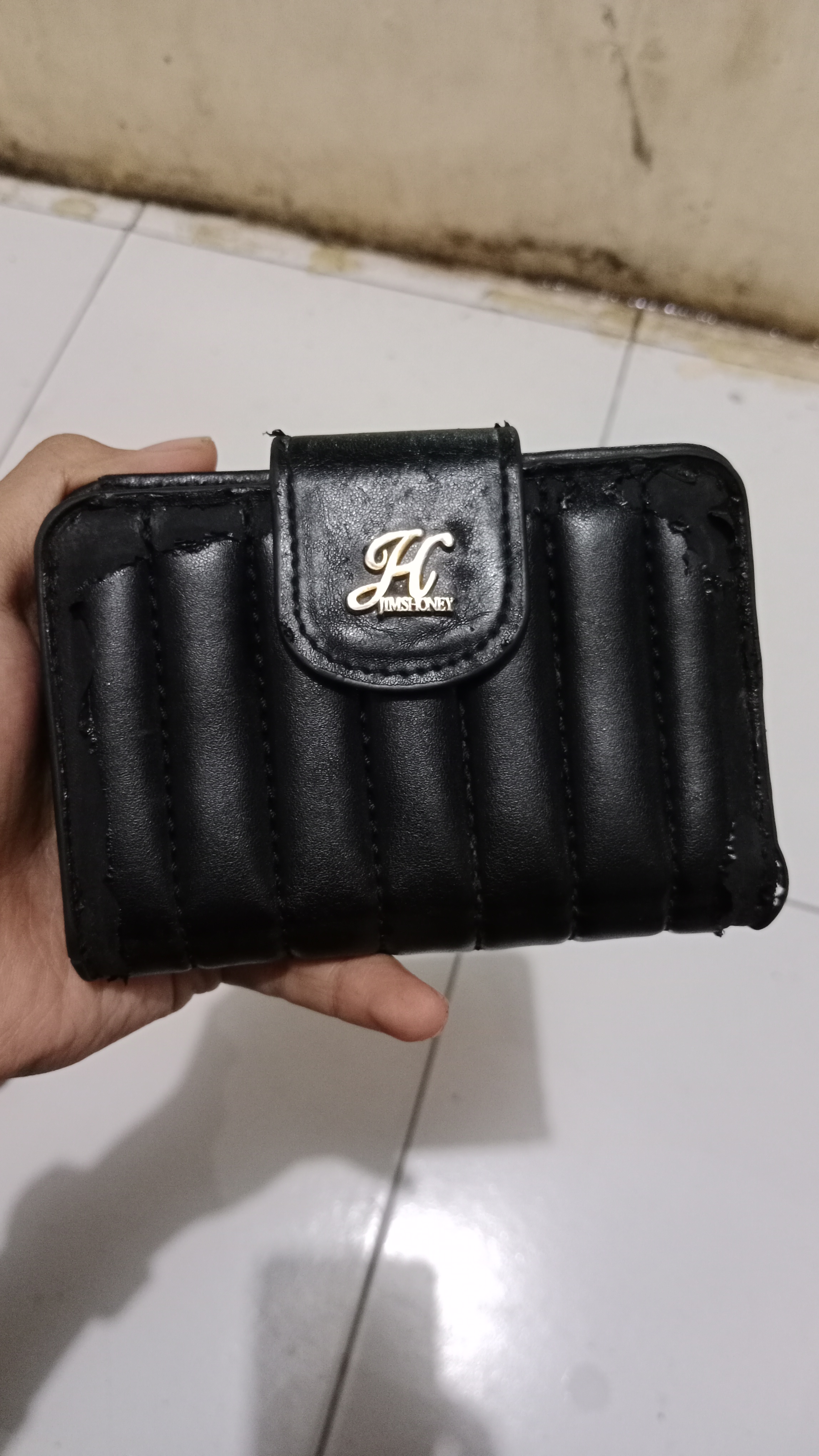 Foto laporan Dompet merek jimshoney (TB0507)