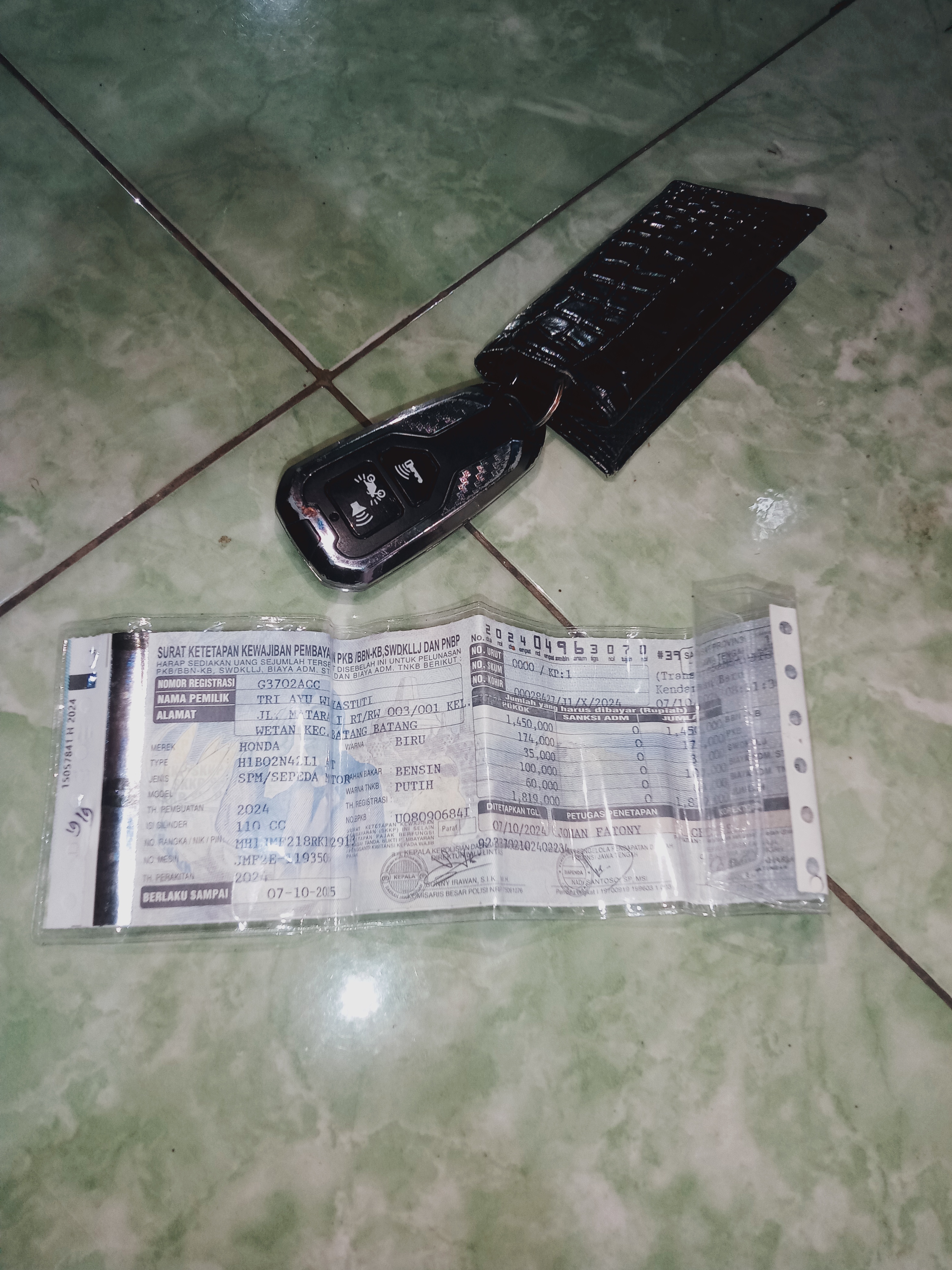 Foto laporan STNK dan remot motor (TB0644)