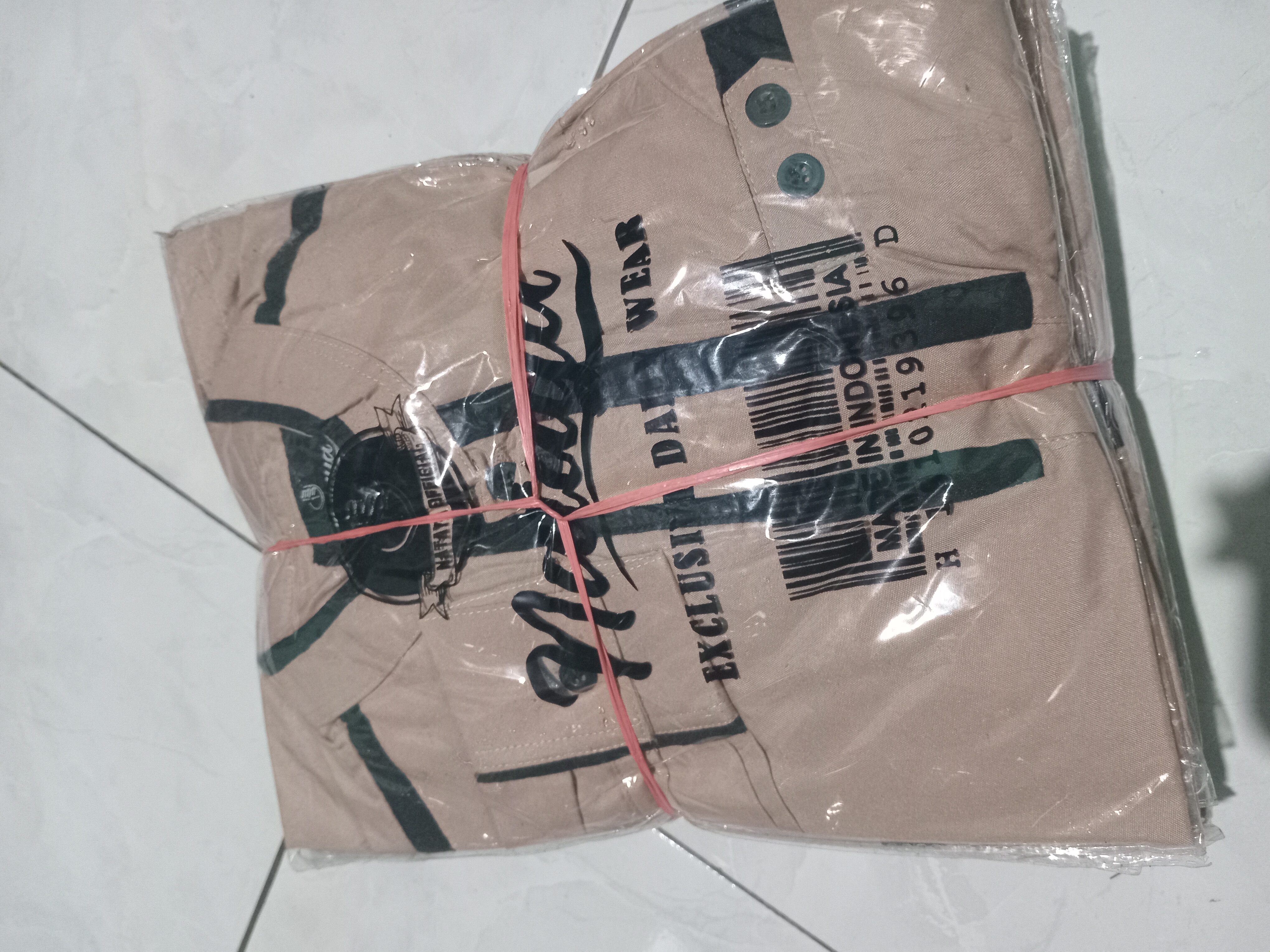 Foto laporan Satu bandel baju koko (TB0658)
