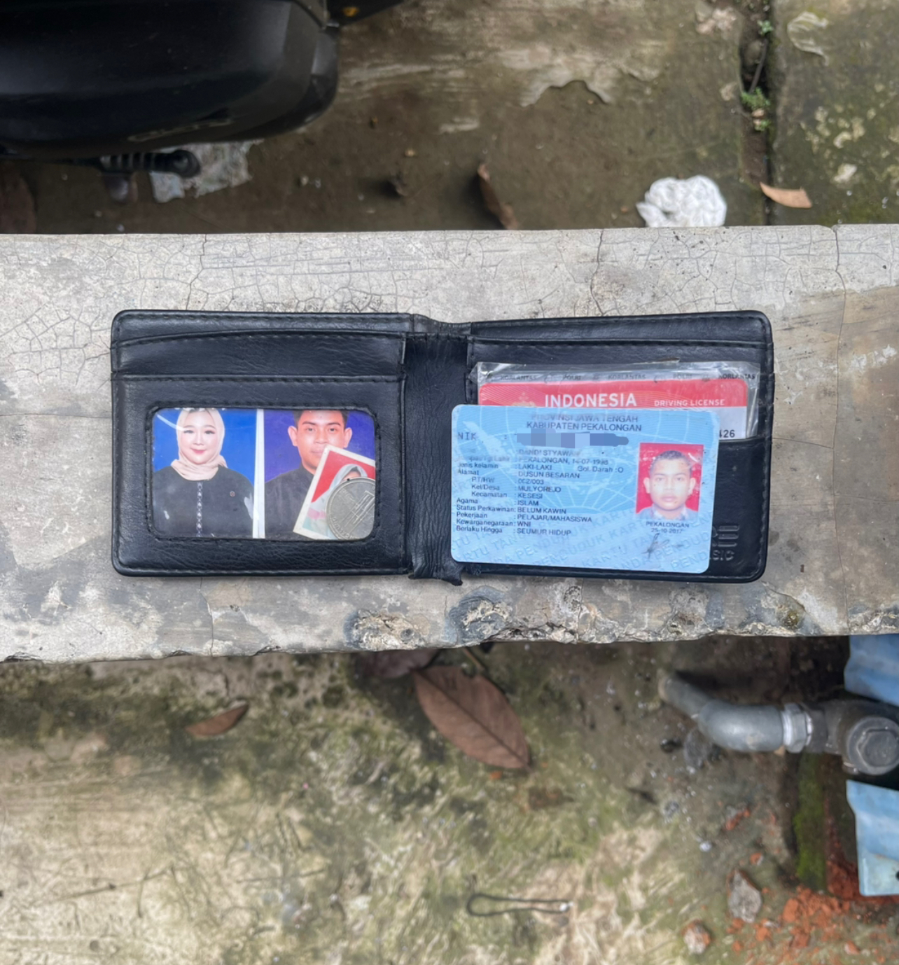 Foto laporan Dompet serta isinya (TB0686)