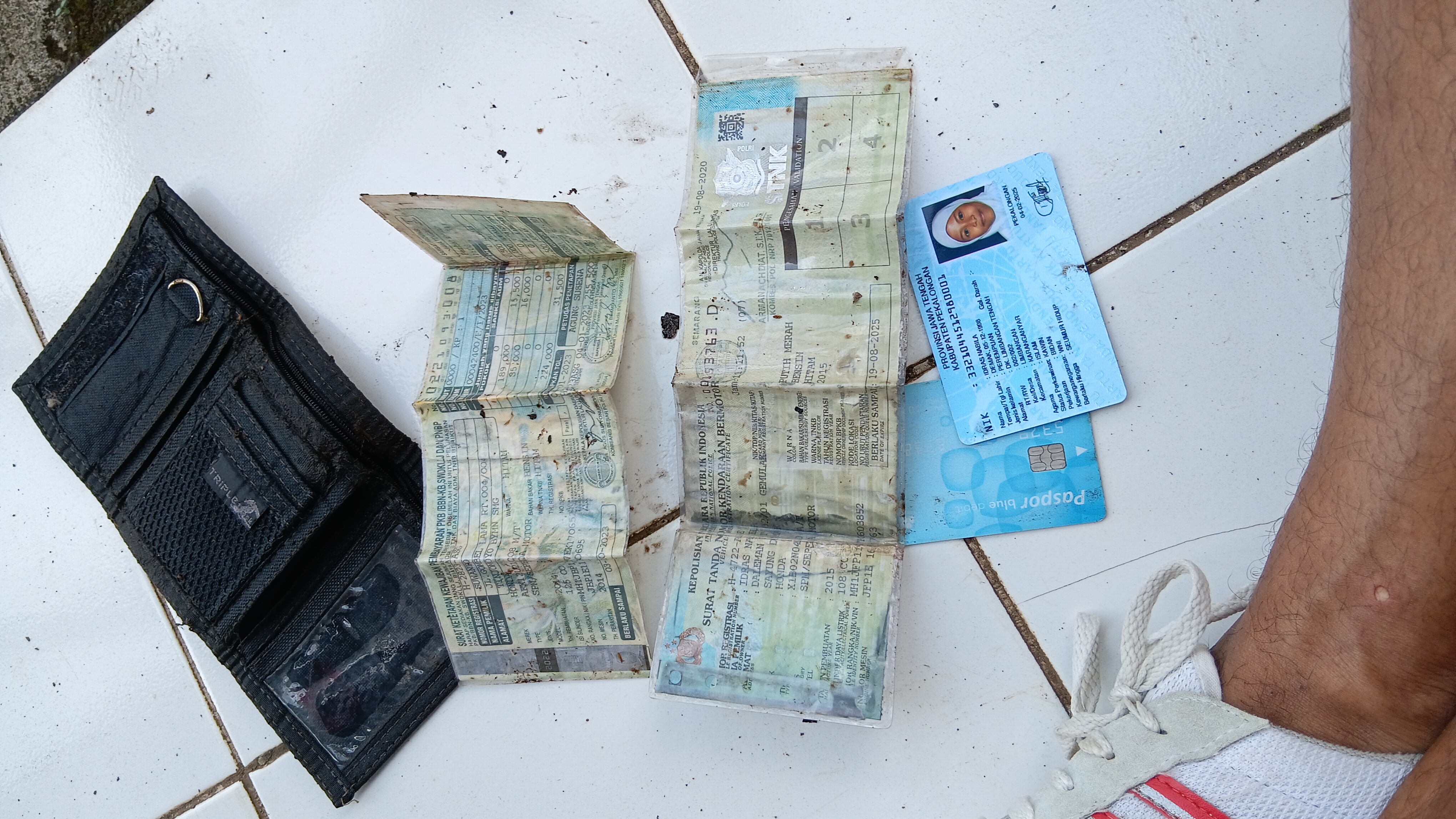 Foto laporan Dompet dan isinya (TB0775)