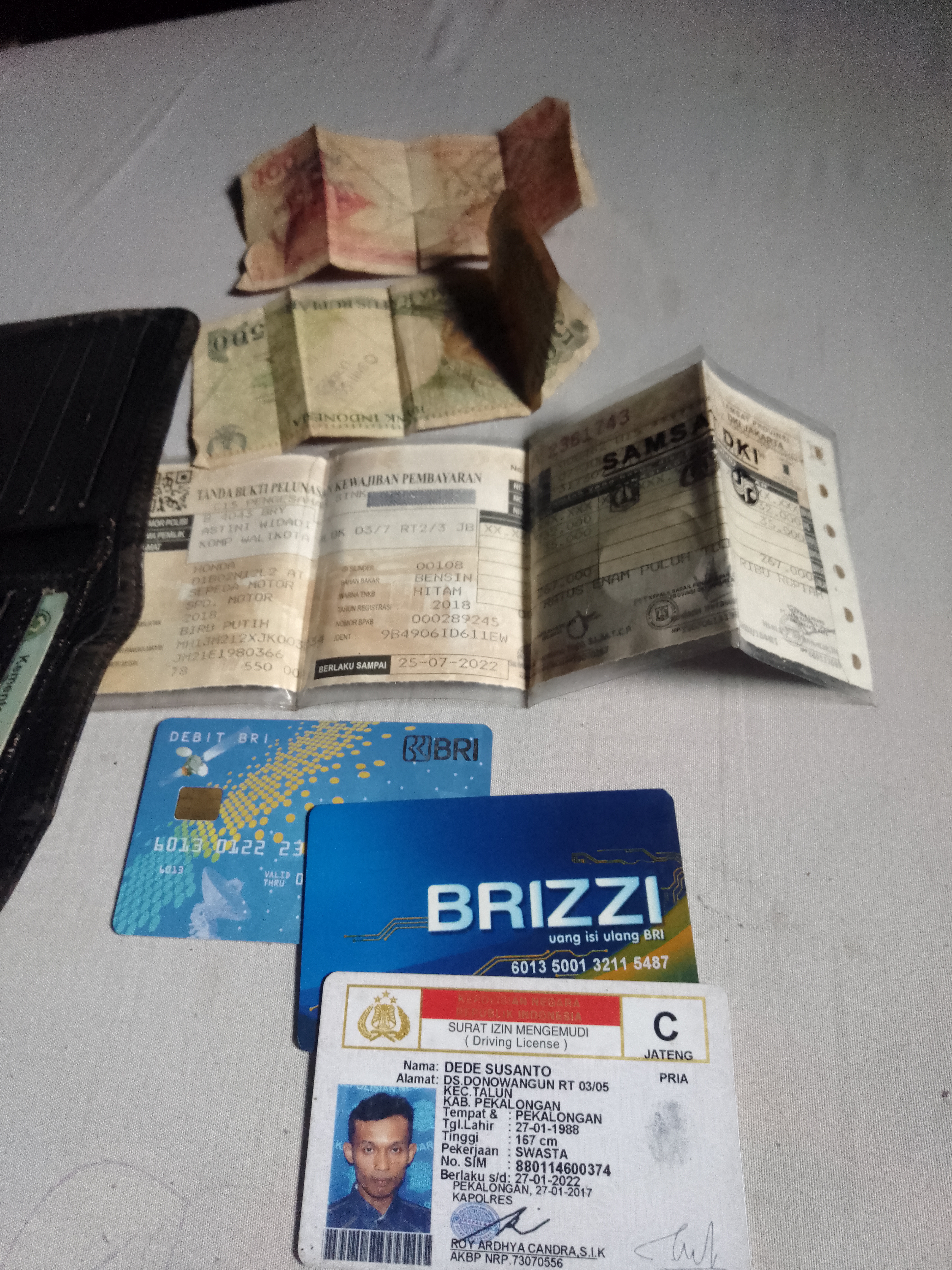 Foto laporan Dompet (TB0827)