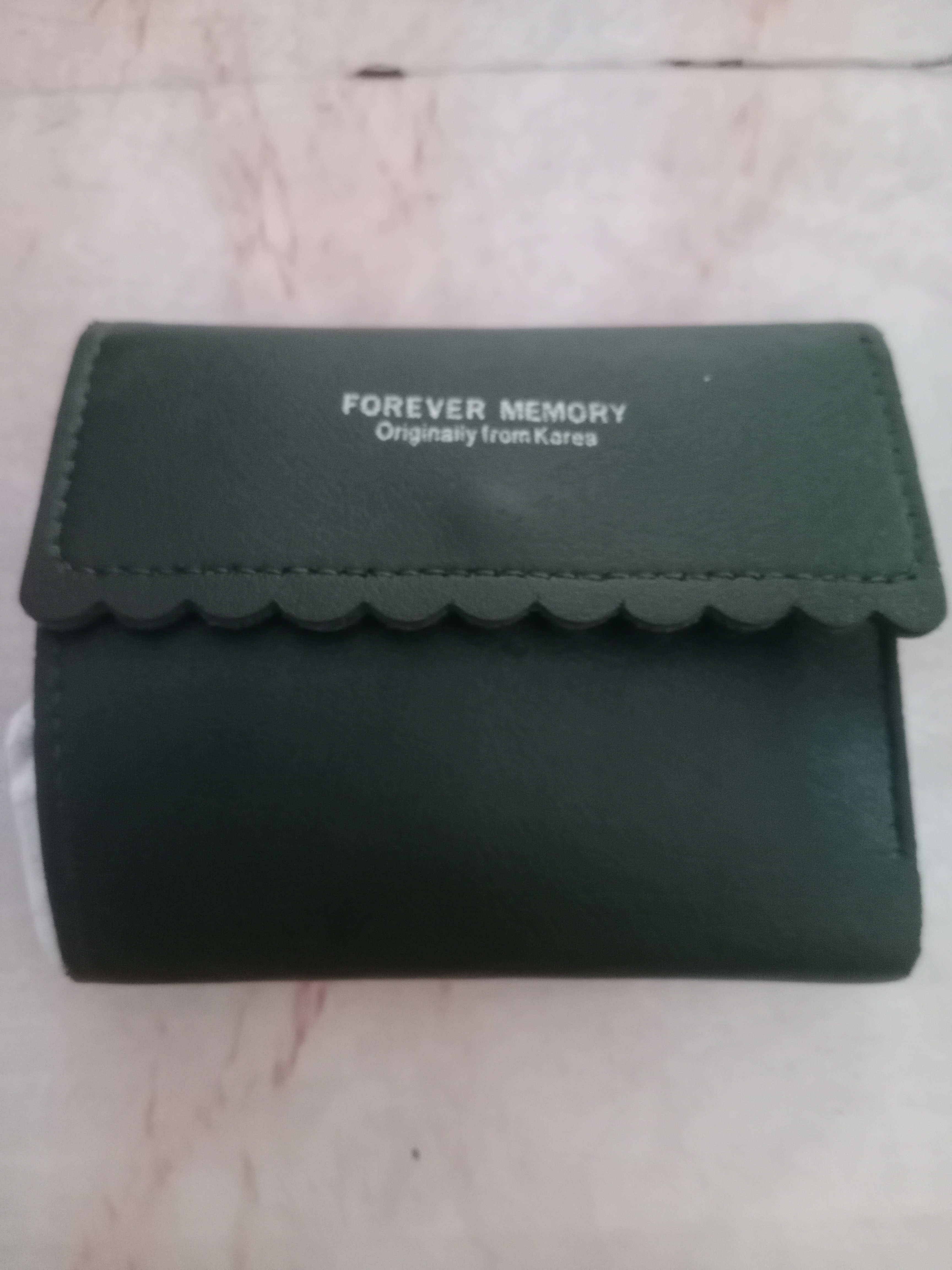Foto laporan Satu buah dompet dg isi di dalamnya KTP, SIM C , kartu ATM BRI, kartu BPJS dan Kartu Perpustakaan atas nama Agus Suryo Wirawan (TB0864)