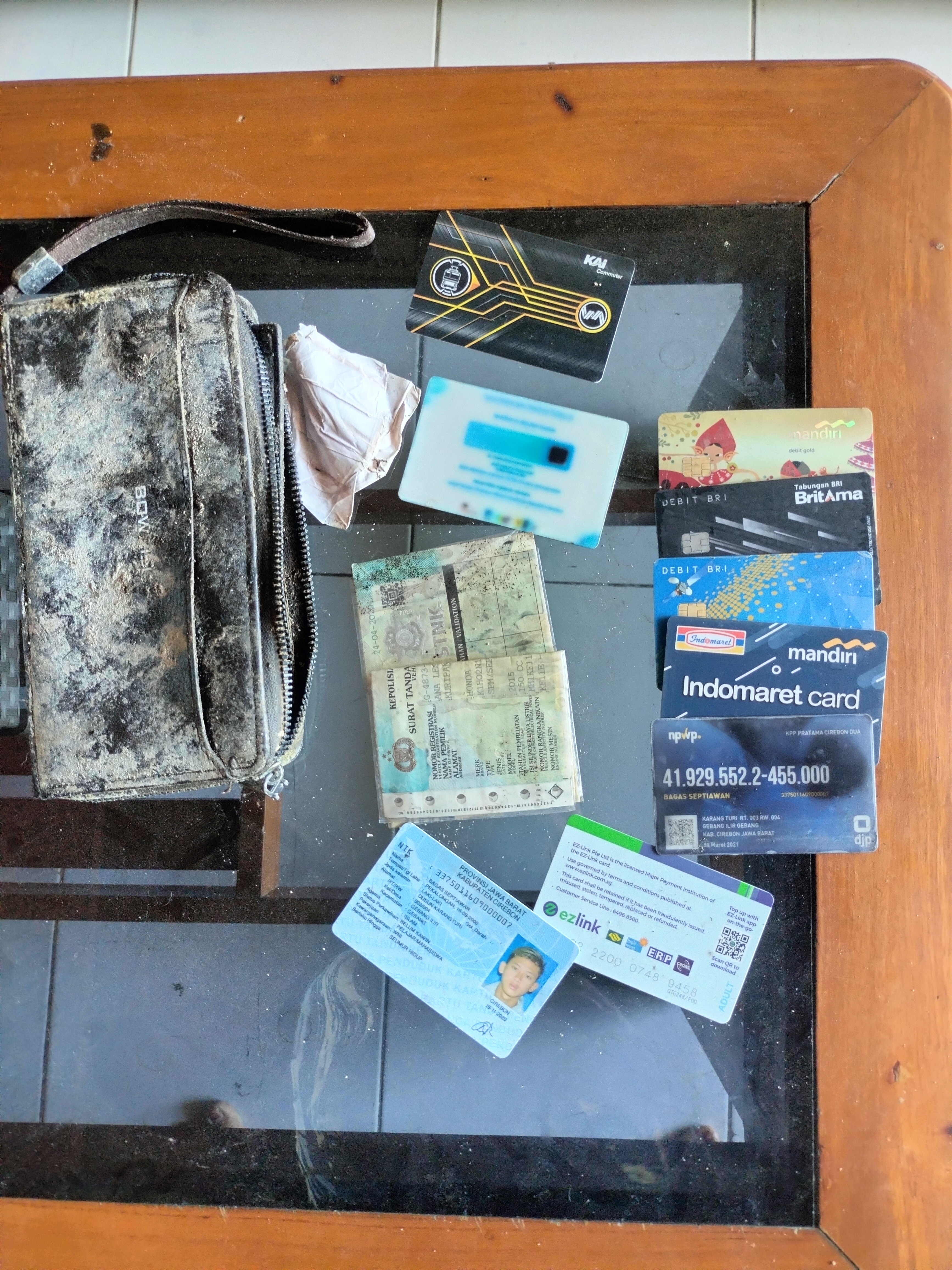 Foto laporan Dompet (TB1315)