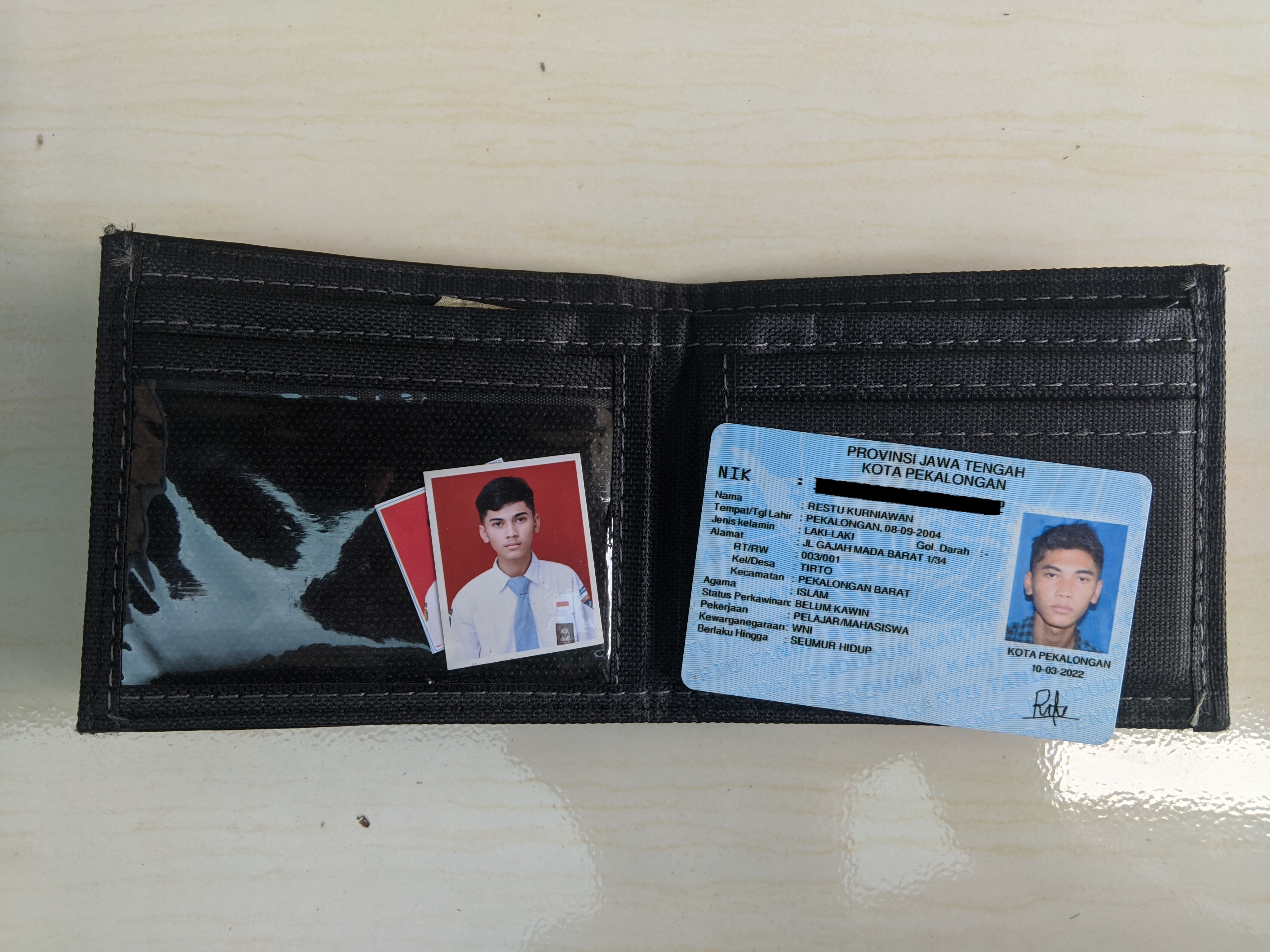 Foto laporan dompet (TB1419)